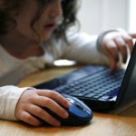 Child On Computer by Clare Bloomfield (FreeDigitalPhotos.net)